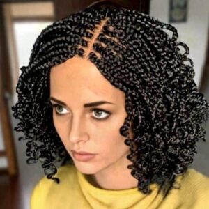 a person with short braided wig
