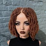 a mannequin head with an afro kinky twists style wig